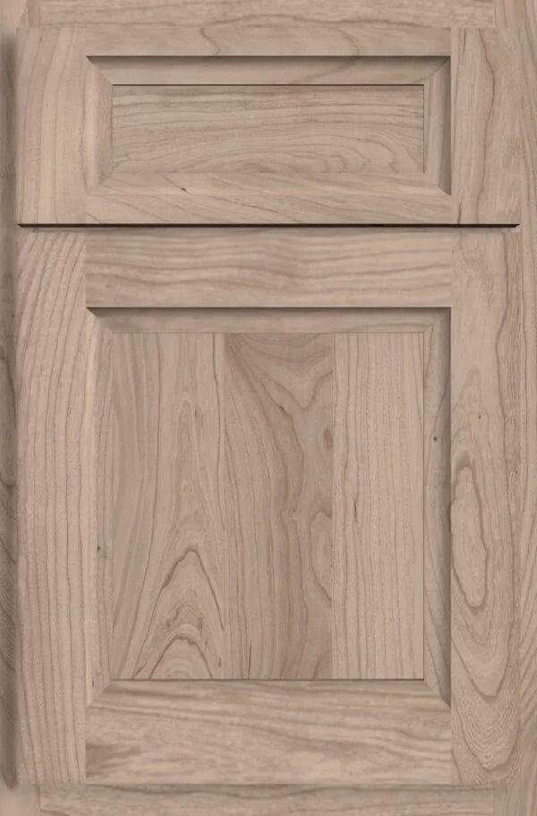 Light-colored wooden cabinet door with raised panel and rectangular details.