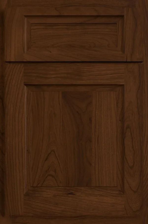 Dark brown wooden cabinet door with raised panel design.