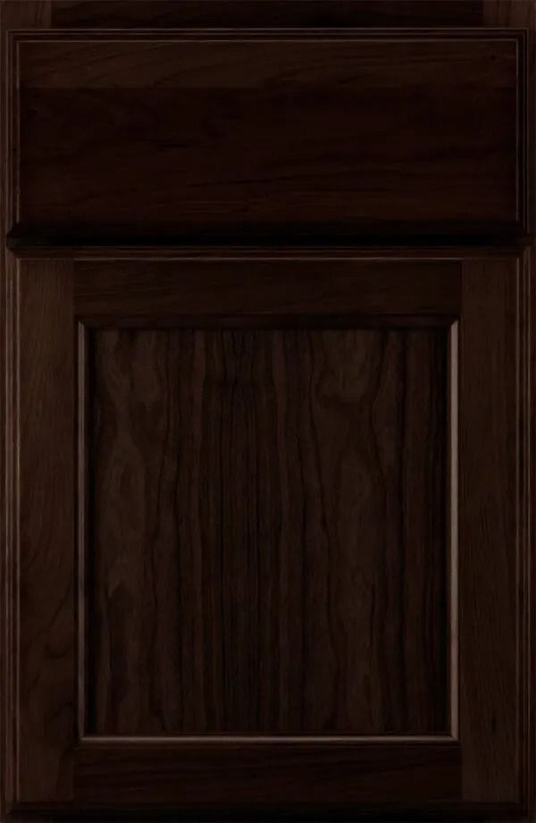 Dark brown wooden cabinet door with a raised panel.