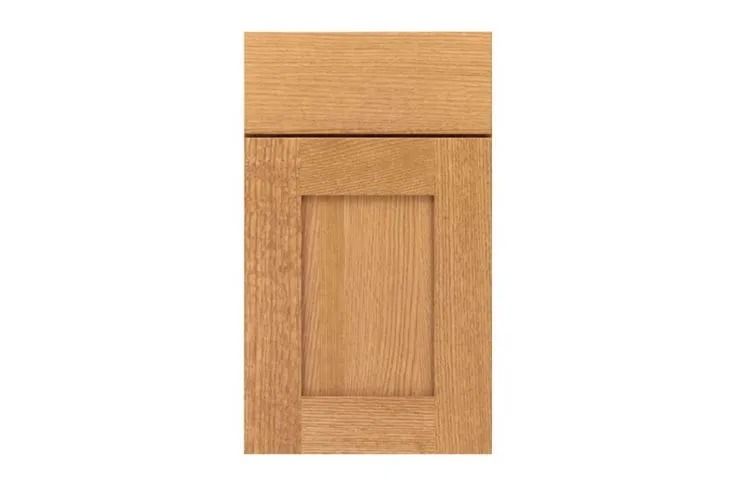 Light oak cabinet door with a raised center panel.