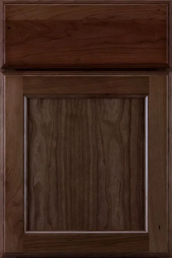 Wooden cabinet door with raised panel in a medium brown finish.