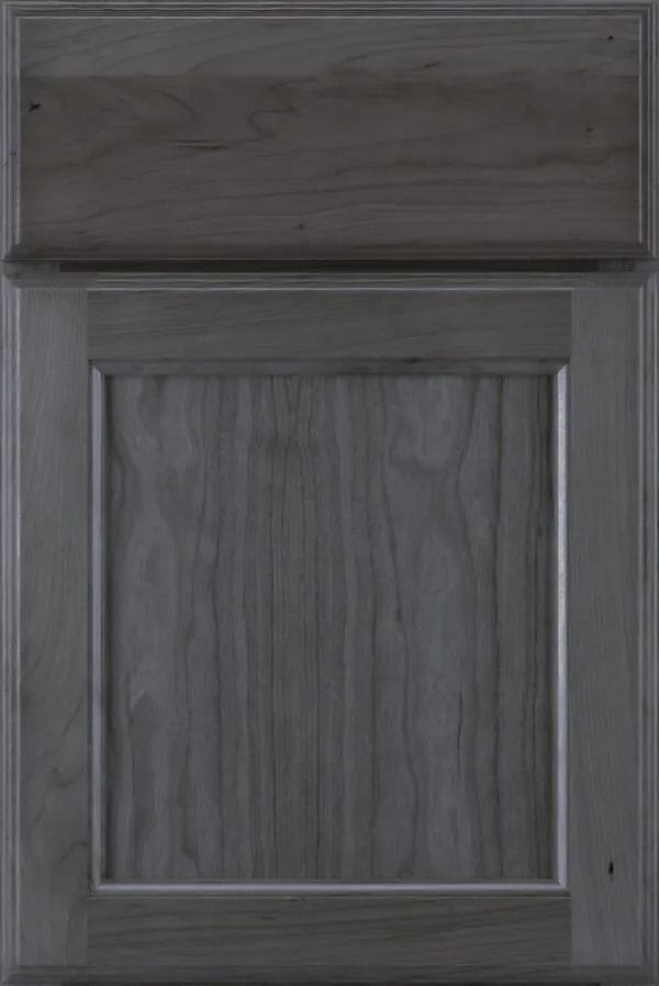 Gray-stained wood cabinet door with a raised panel design, showing wood grain.
