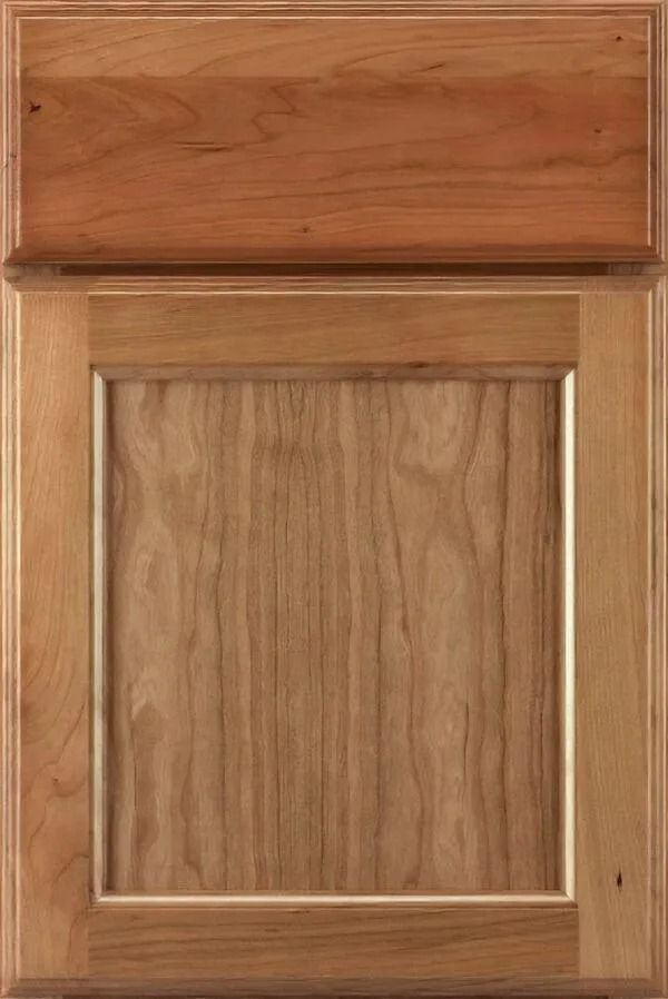 Cherry-toned kitchen cabinet door with raised panel and upper inset.