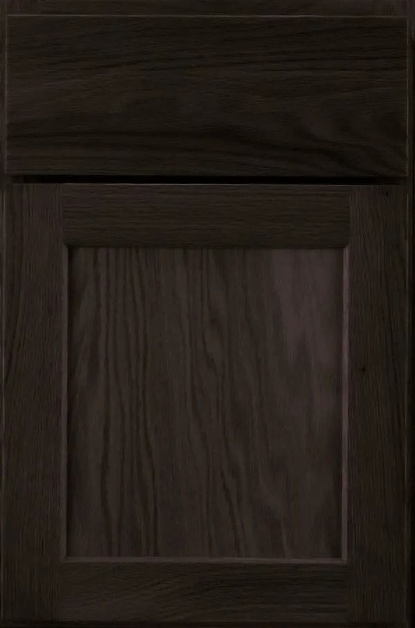 Dark brown wood cabinet door with a rectangular recessed panel.