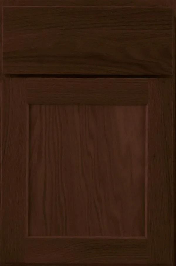 Dark brown kitchen cabinet door with raised panel and top rail.