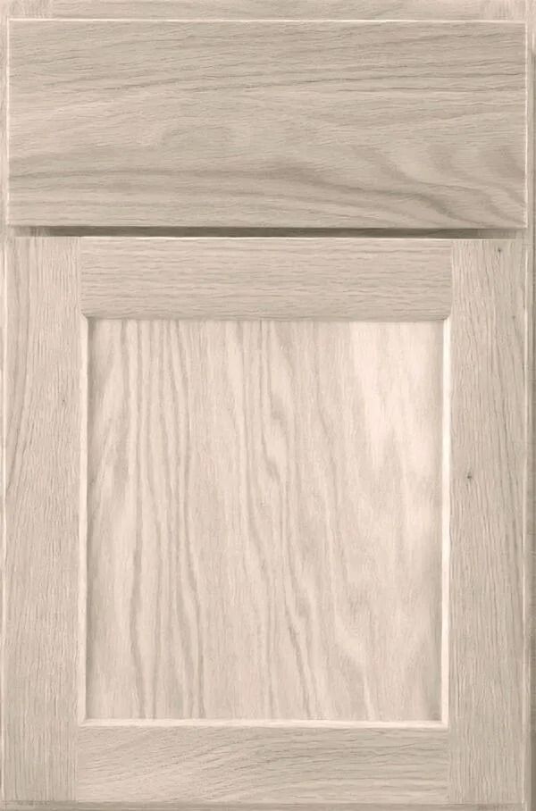 Light-colored wooden cabinet door with a raised panel.