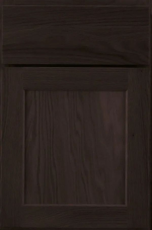 Dark brown wood grain cabinet door.