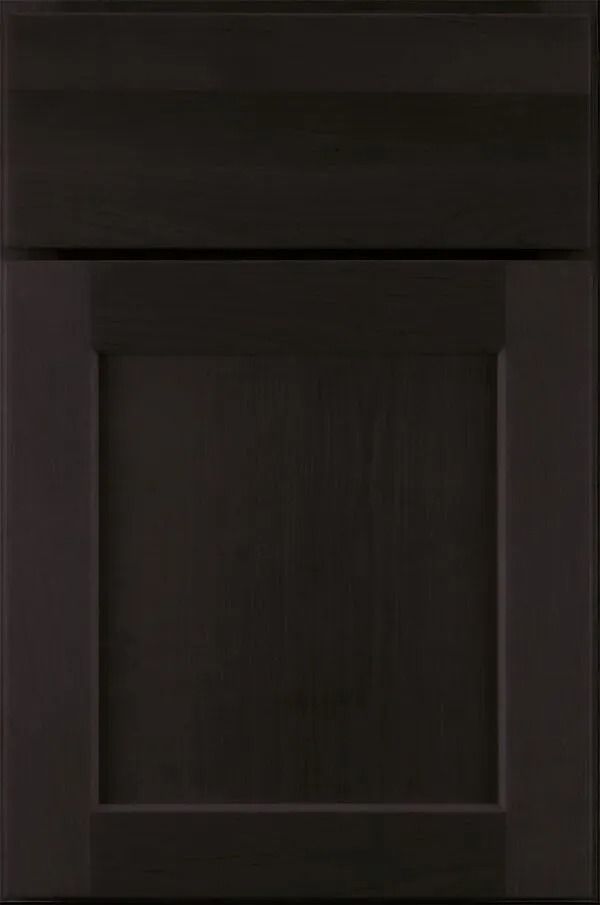 Dark stained wood cabinet door, featuring a recessed panel and shaker style construction.