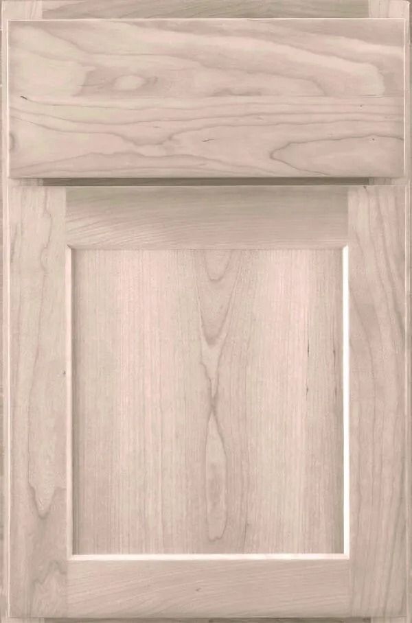 Light wood cabinet door with raised panel and top rail.