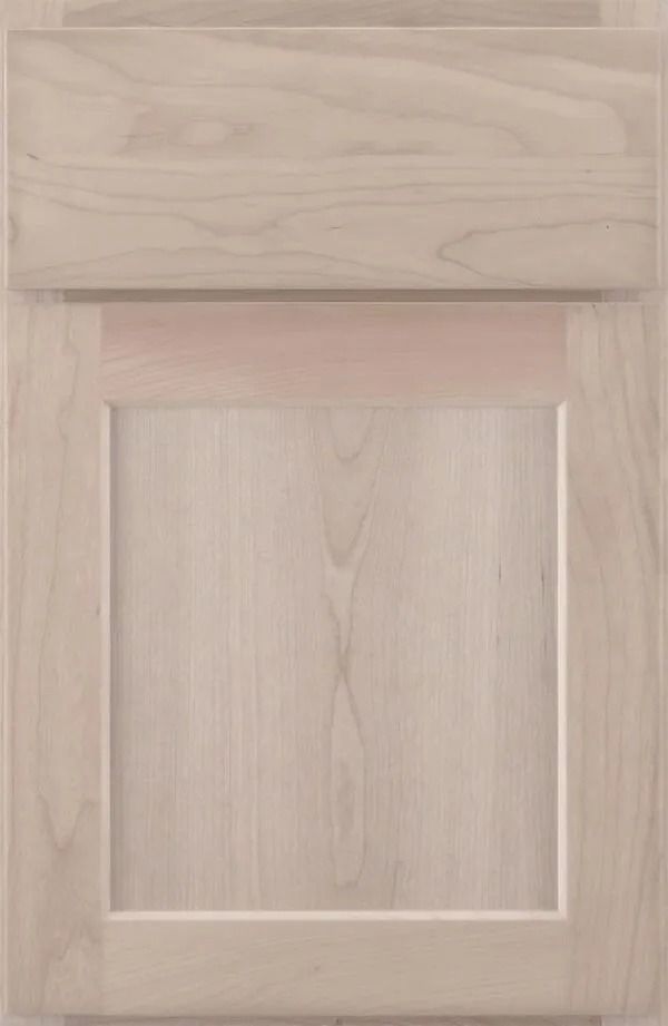 Light wood cabinet door with recessed panel.