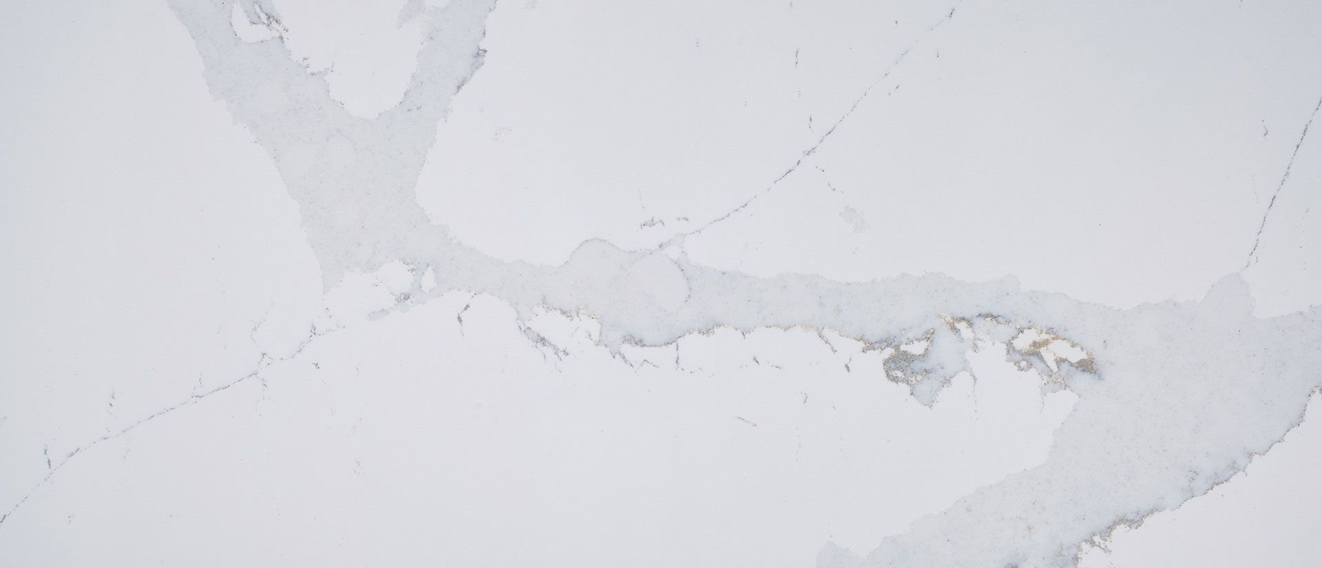 White surface with grey marble veining.