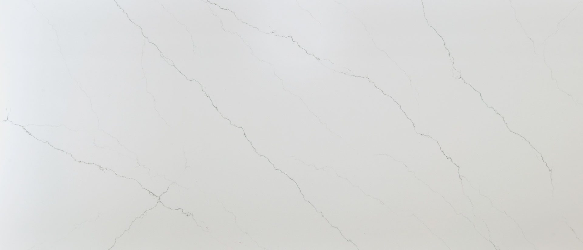 White marble surface with subtle gray veining.