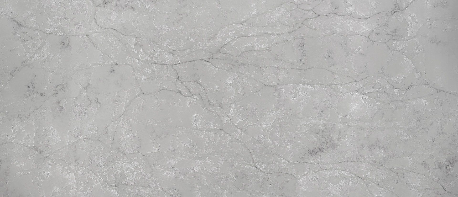Close-up of a white marble countertop with gray veining.