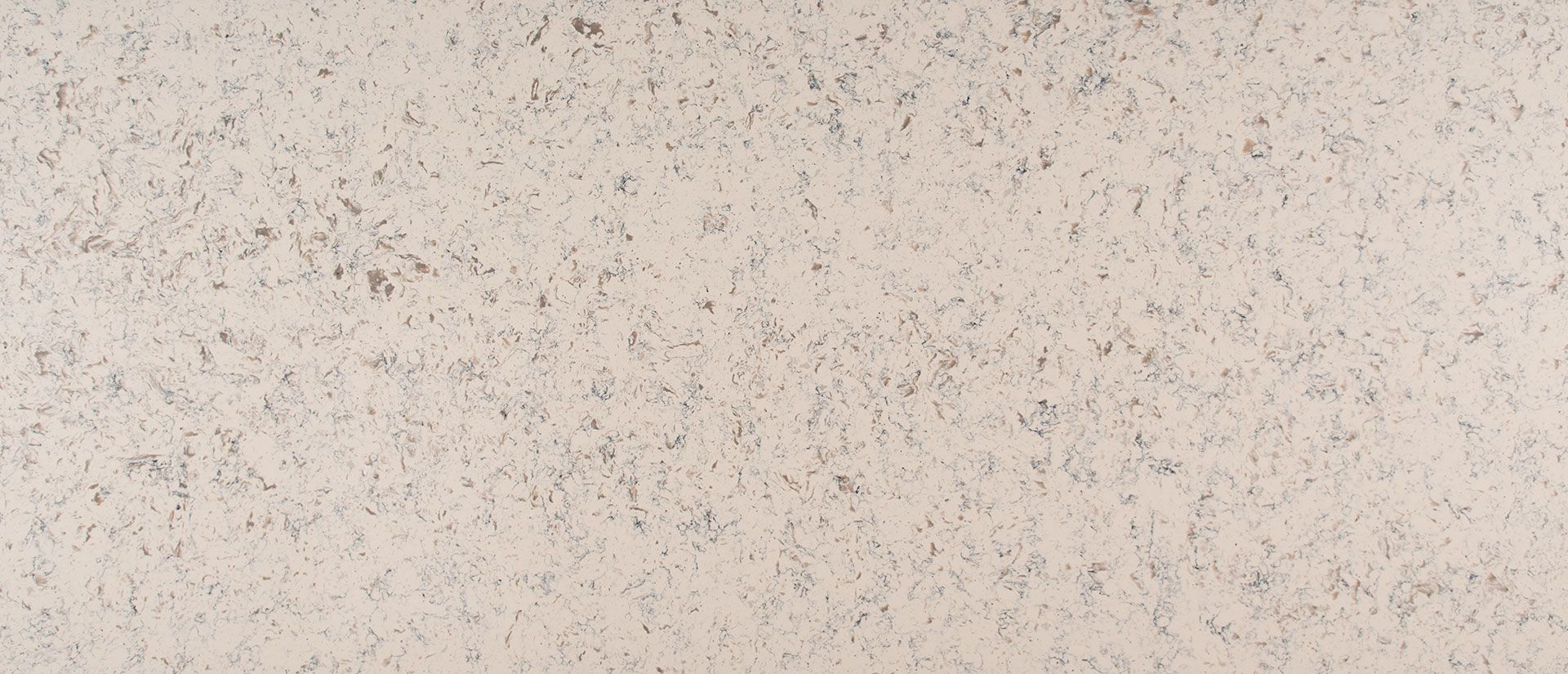 Beige stone surface with small speckled details.
