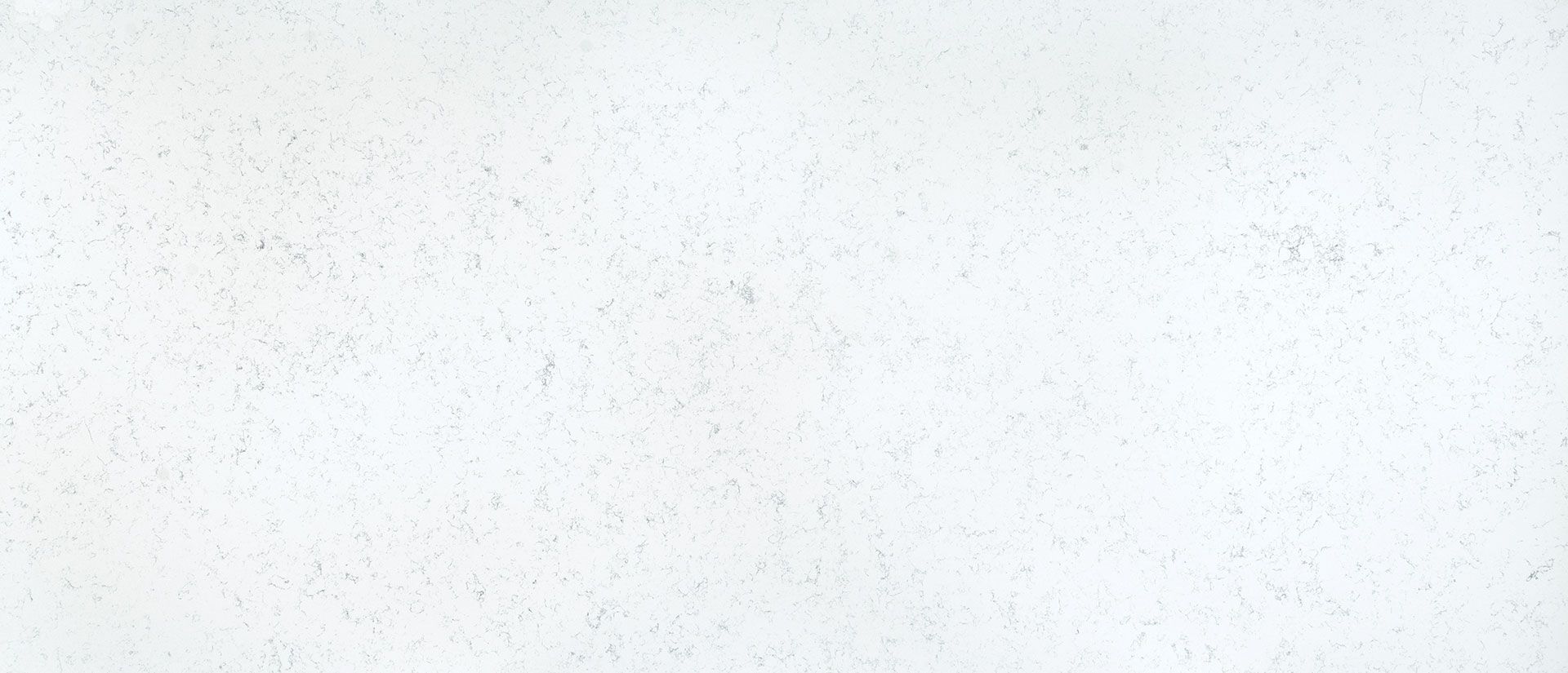 White, textured surface with subtle variations.