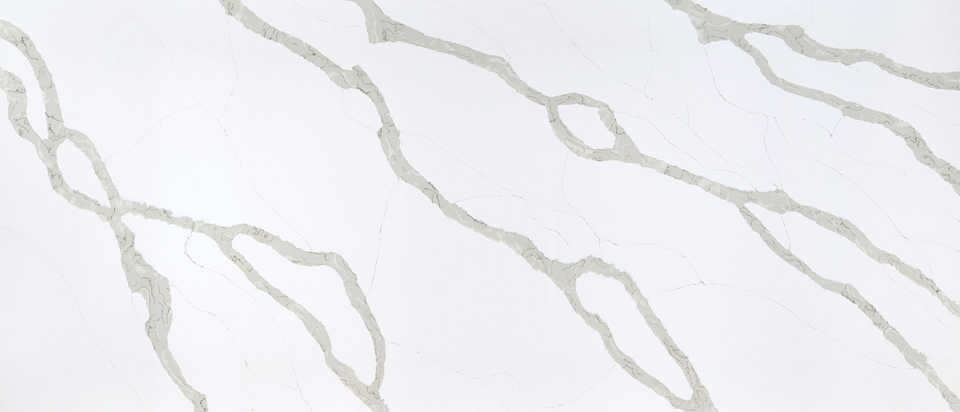 White surface with light gray veining, resembling marble or quartz.