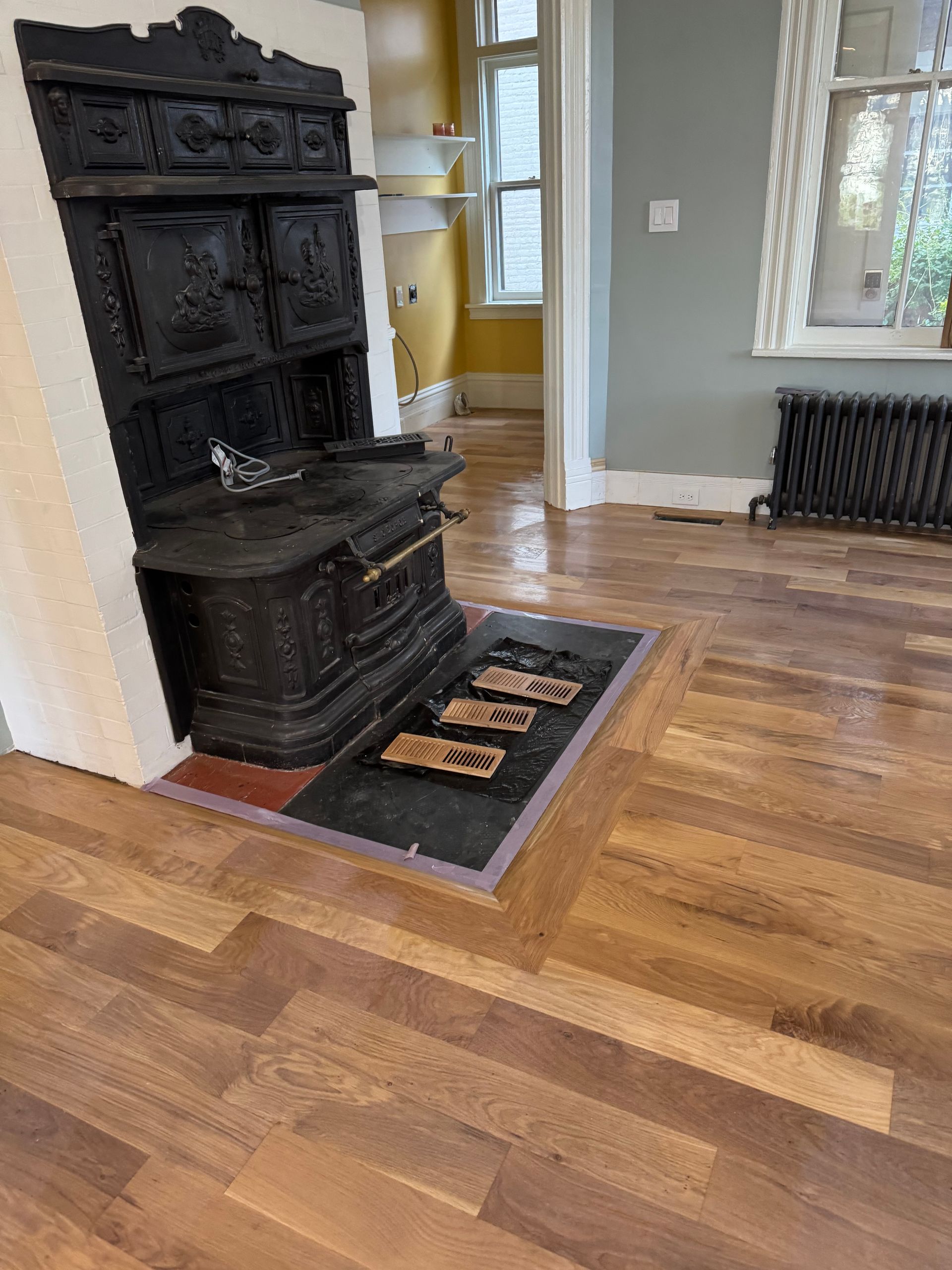 There is a wood stove in the middle of the room.