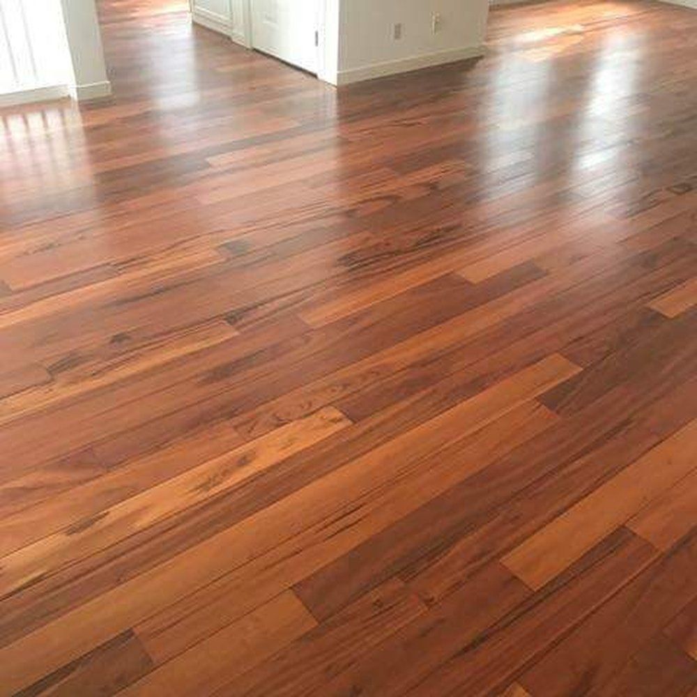A living room with hardwood floors in a house.