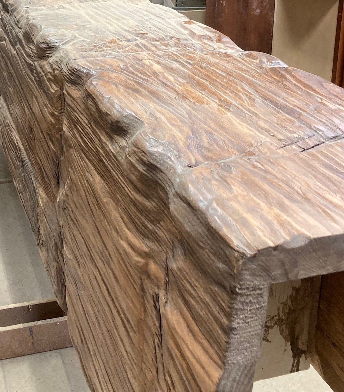 A large piece of wood is sitting on a table