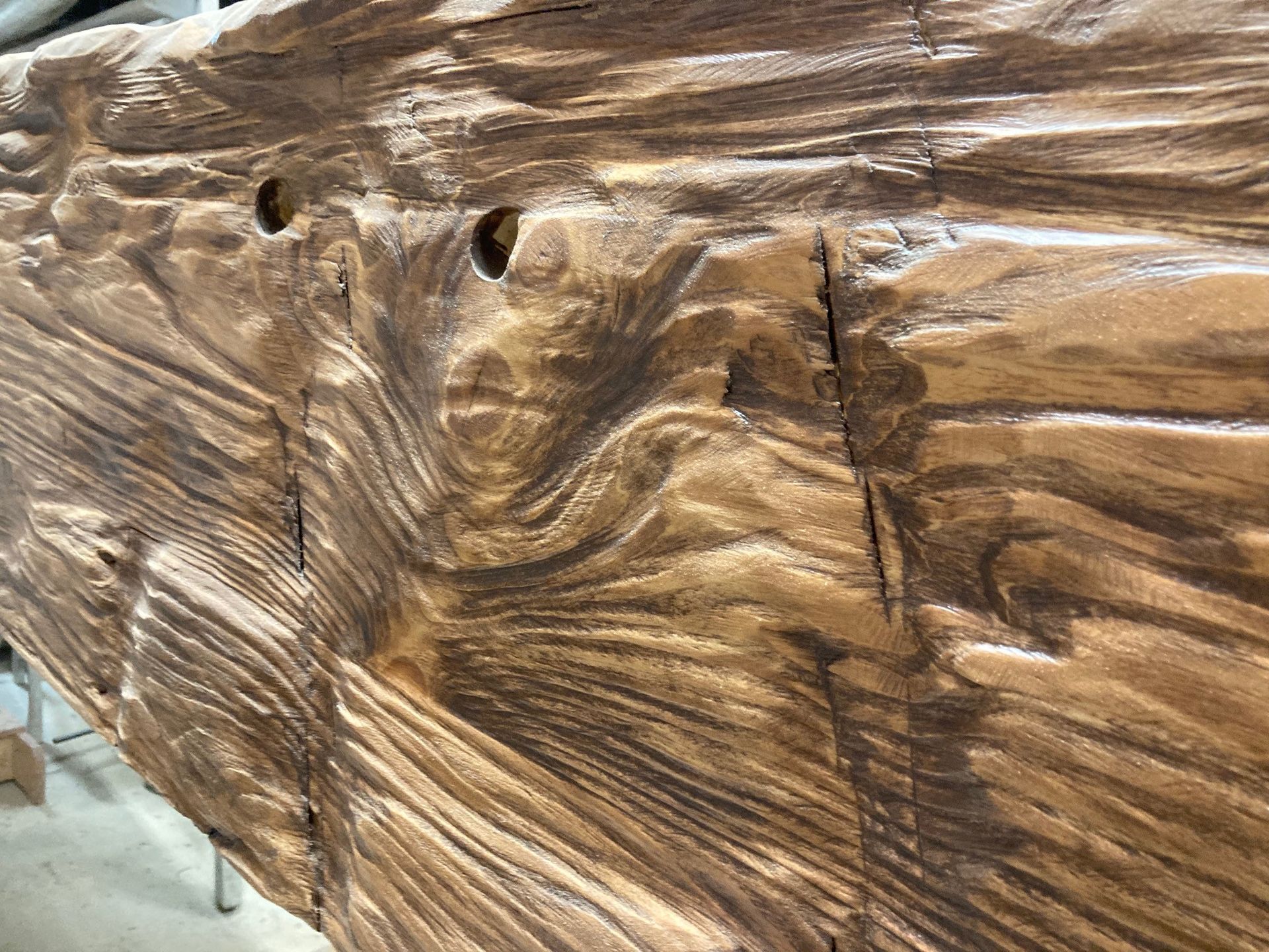 A close up of a piece of wood with holes in it