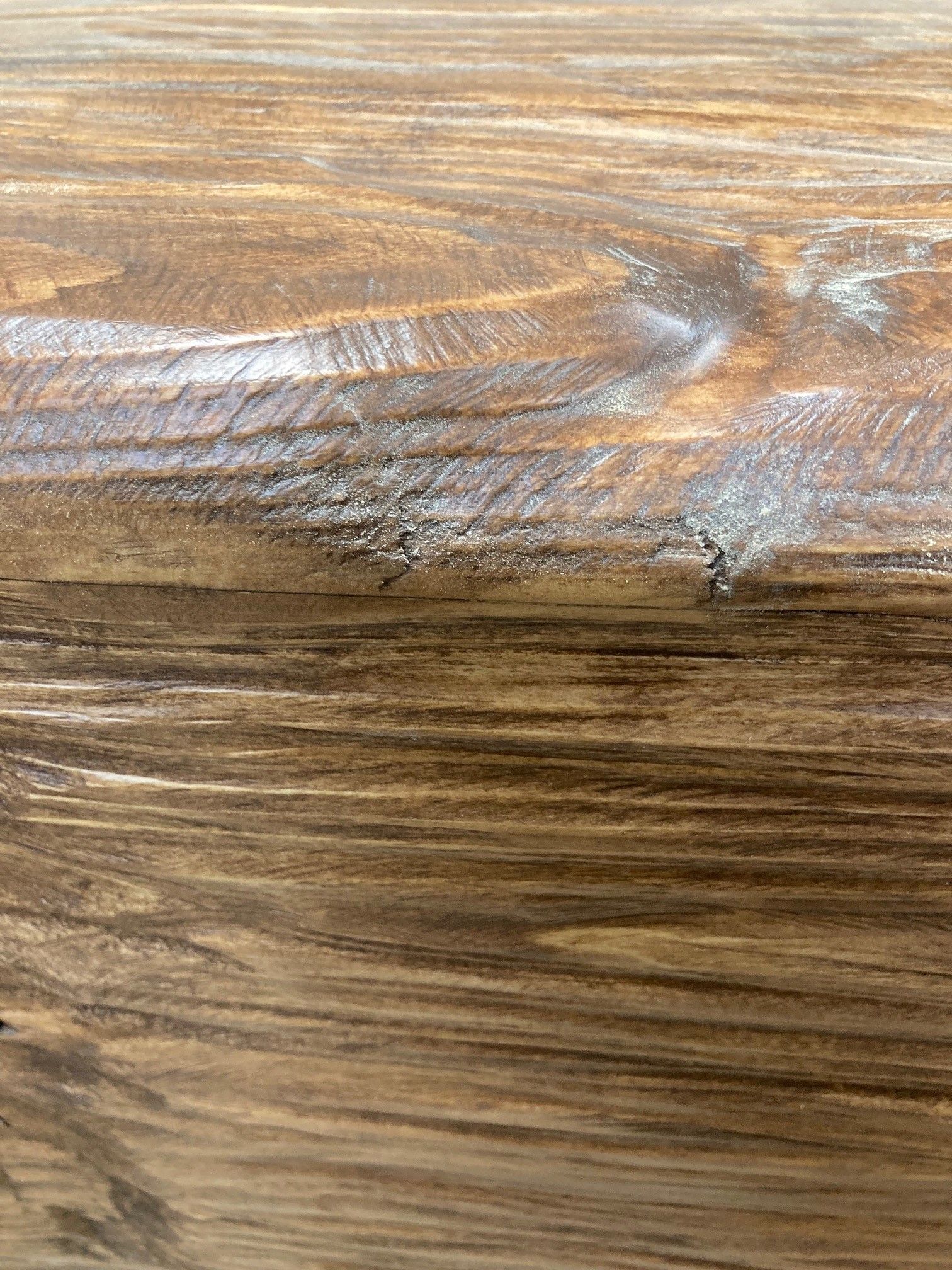 A close up of a piece of wood showing the grain and texture