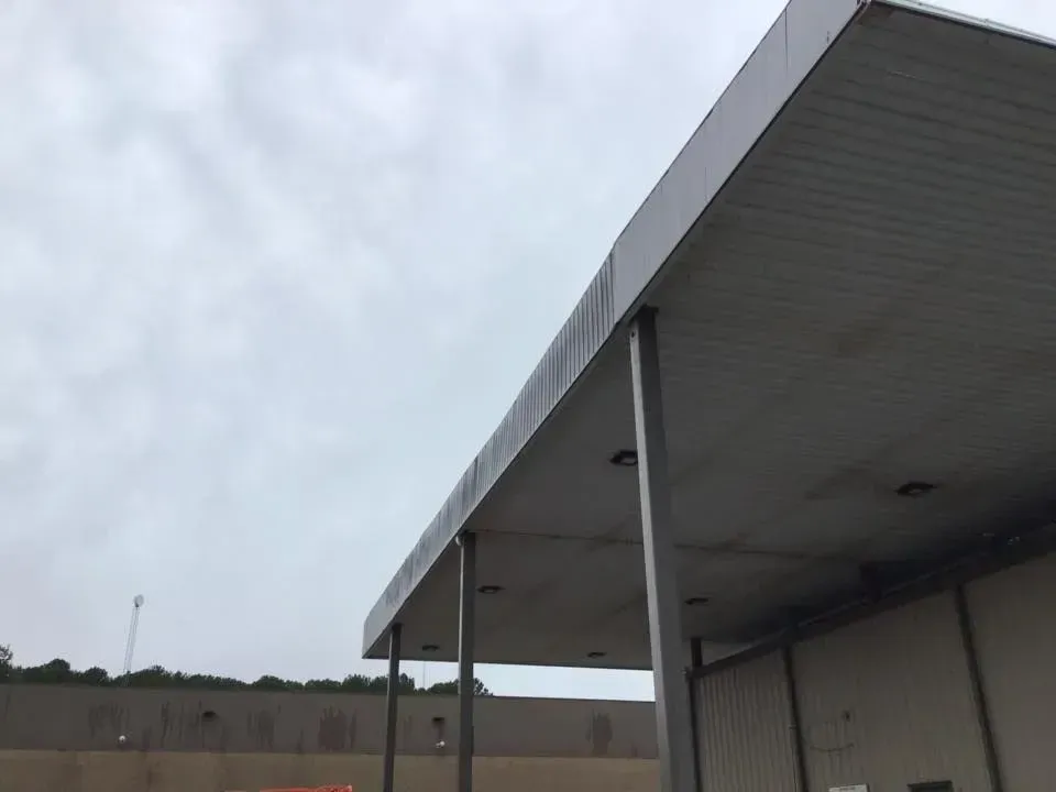 The roof of a building with a canopy over it
