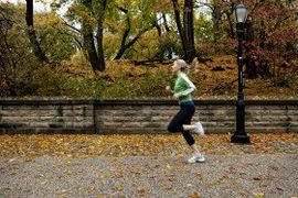 Woman jogging with foliage