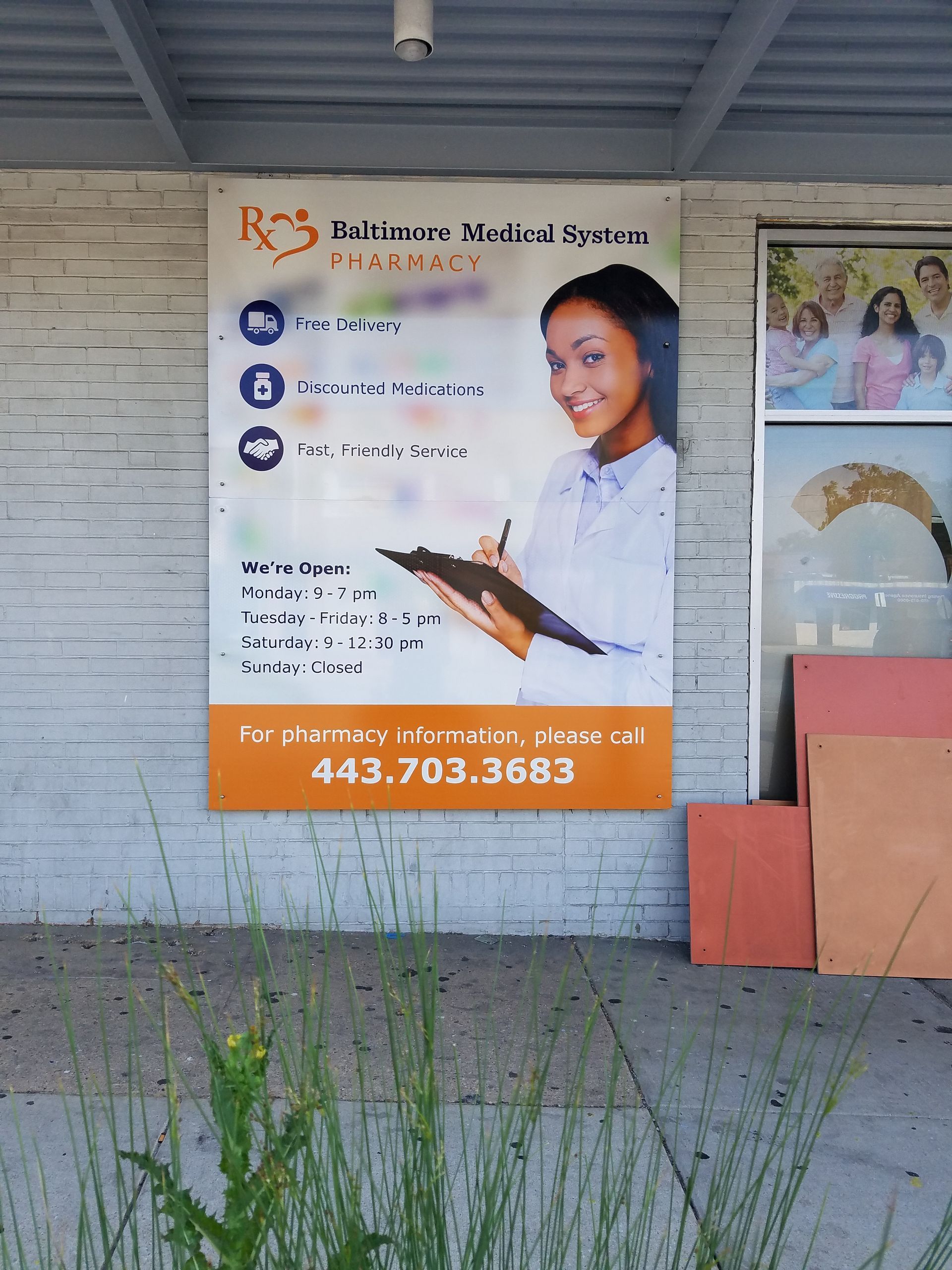 A sign on a brick wall advertising Ros Medical Store