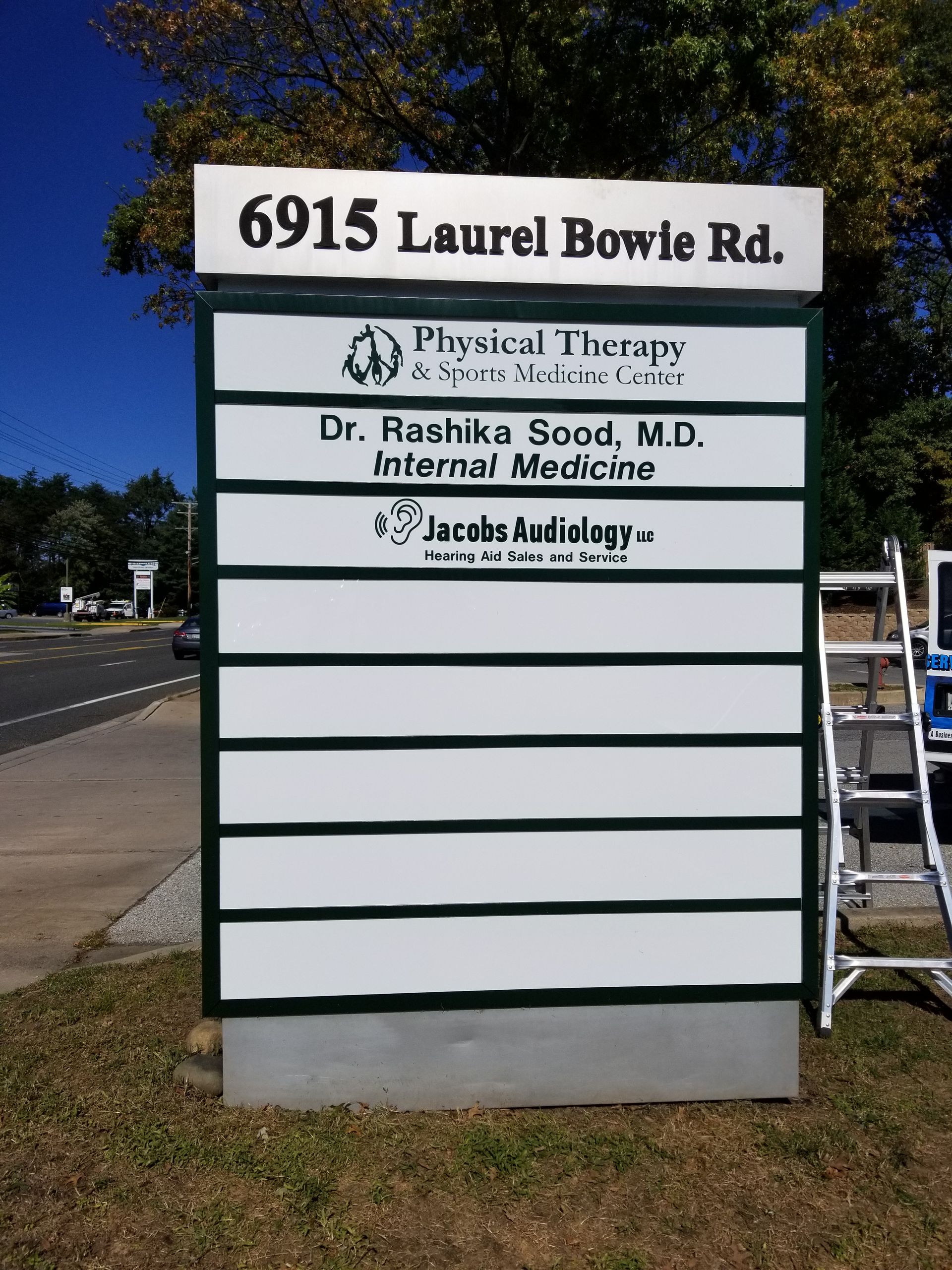 A sign that says 6915 laurel bowle rd. on it