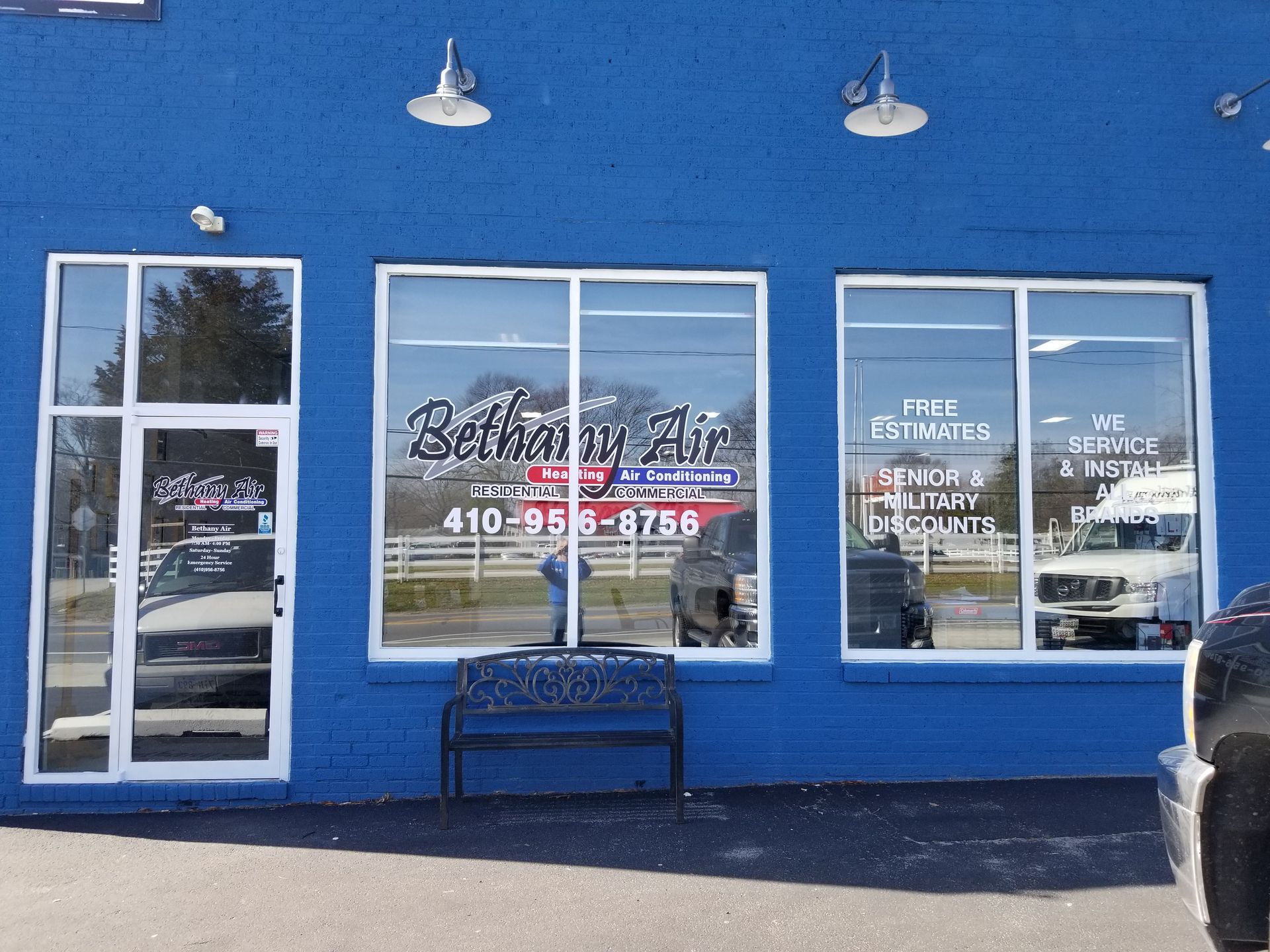 A blue building with a bench in front of it
