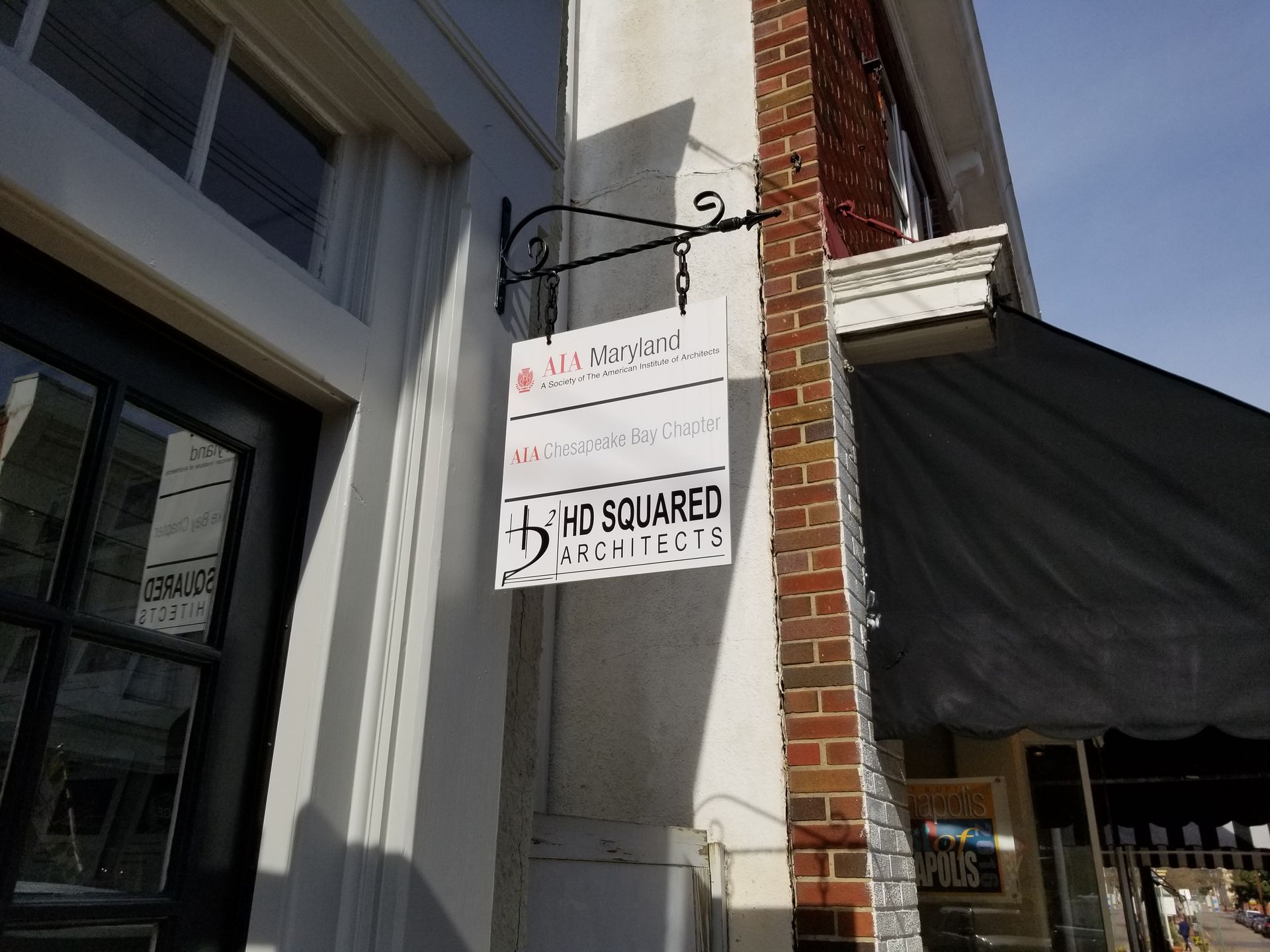 A sign on the side of a building that says bad squared