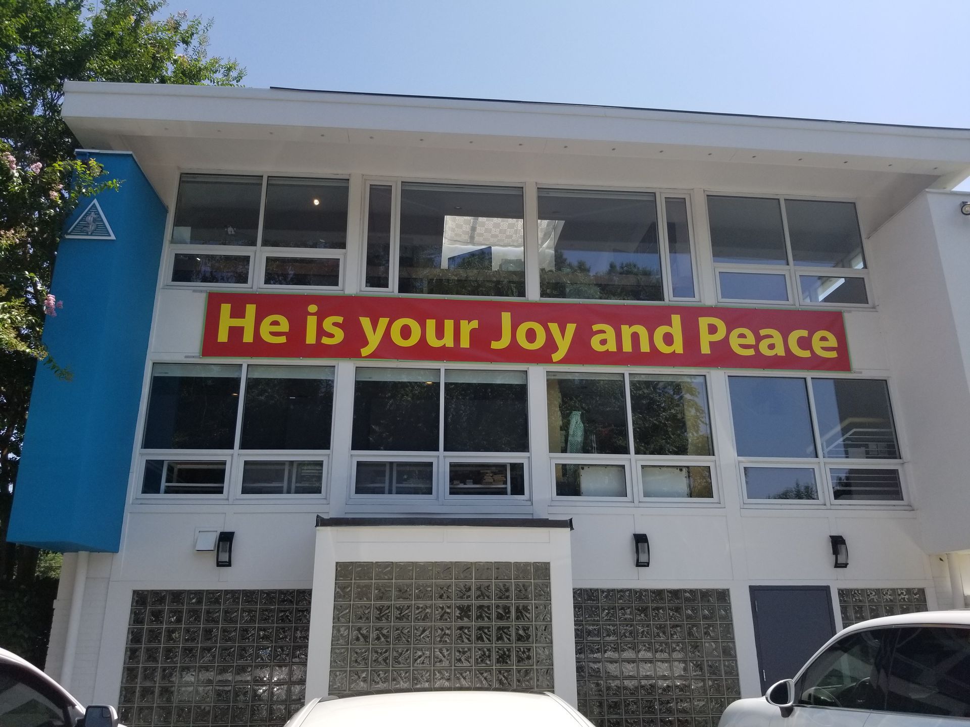 A building with a sign that says he is your joy and peace