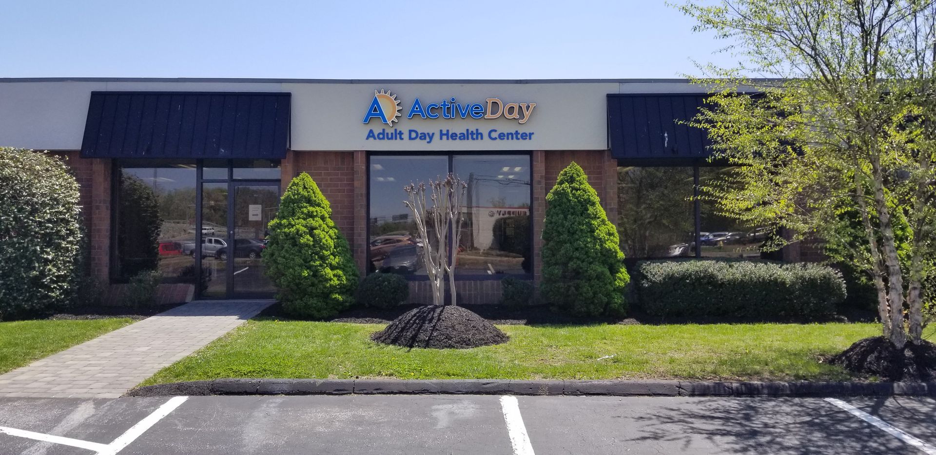 A large brick building with a sign that says a child day health center.