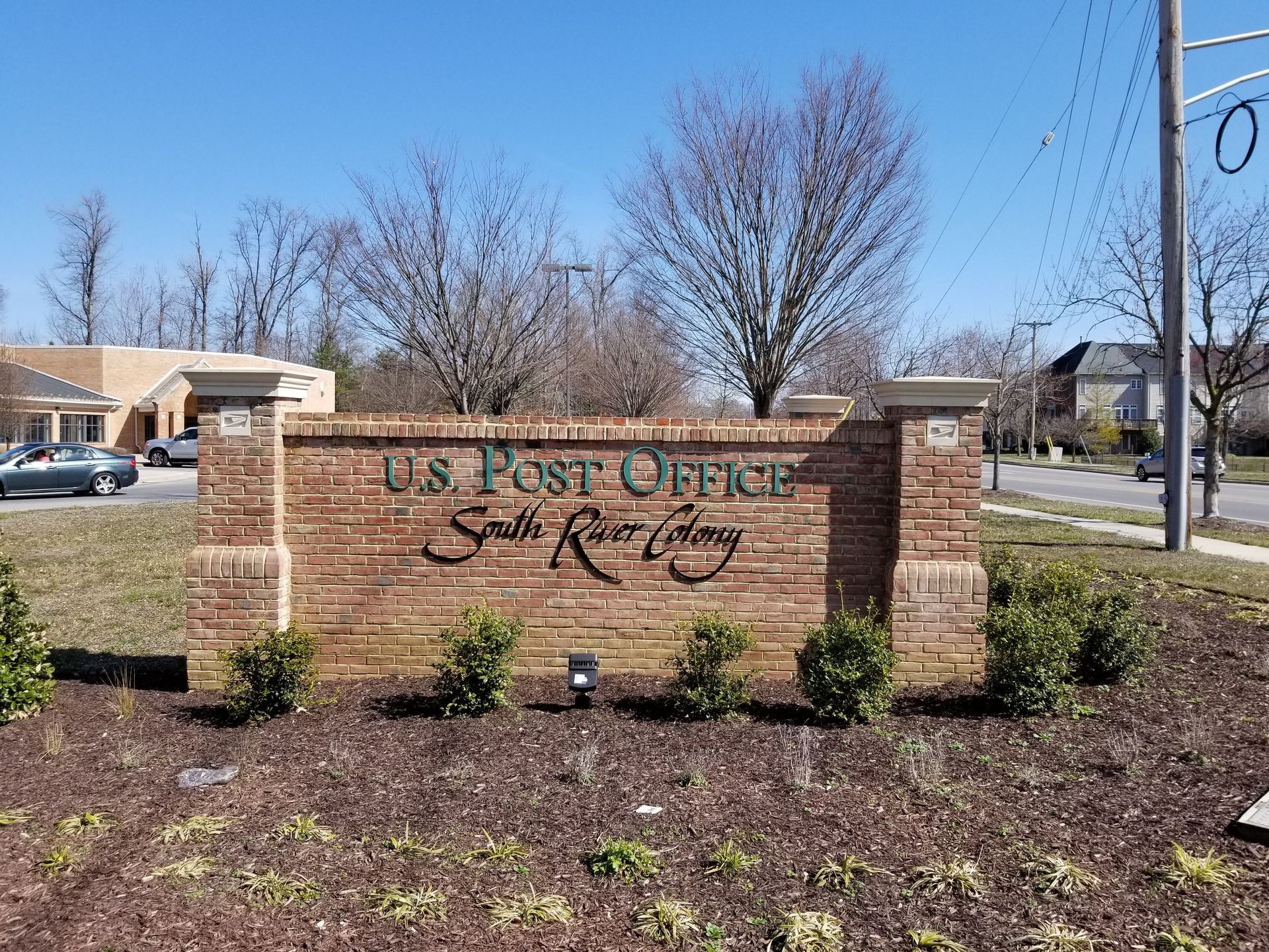 A brick sign for the u.s. post office