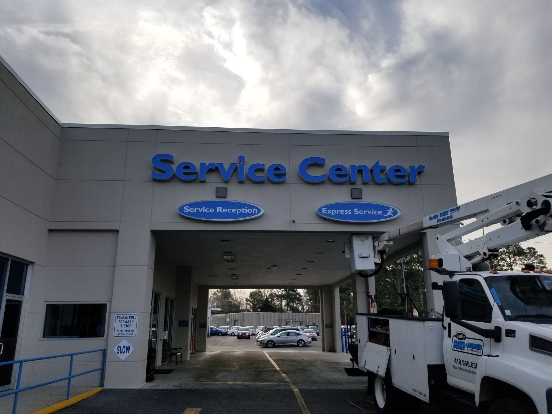 A service center with a truck parked in front of it