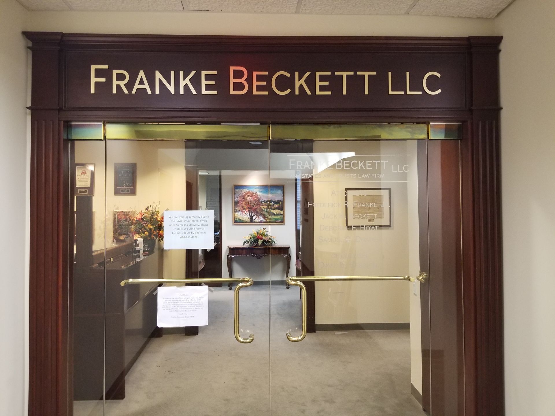 The entrance to franke beckett llc has a glass door