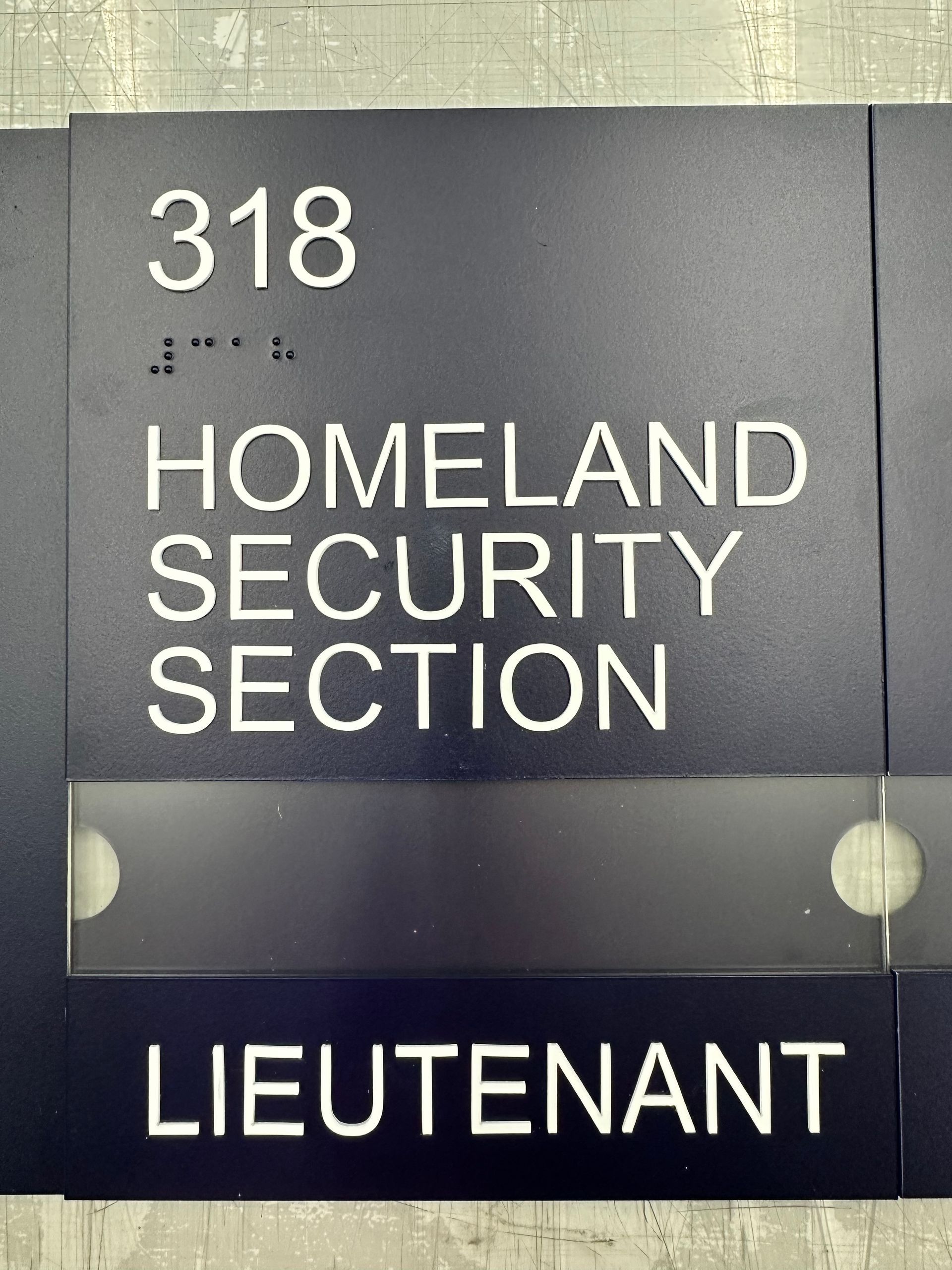 A sign that says 318 homeland security section lieutenant