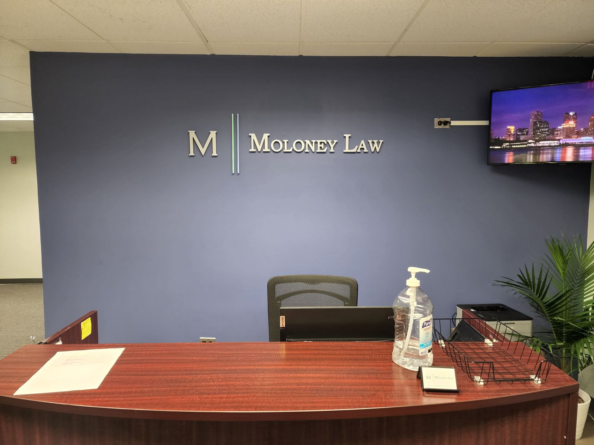 A reception desk with a sign that says m on it