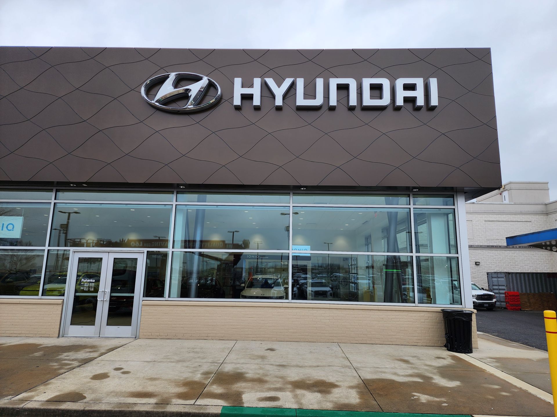A hyundai car dealership with a lot of windows