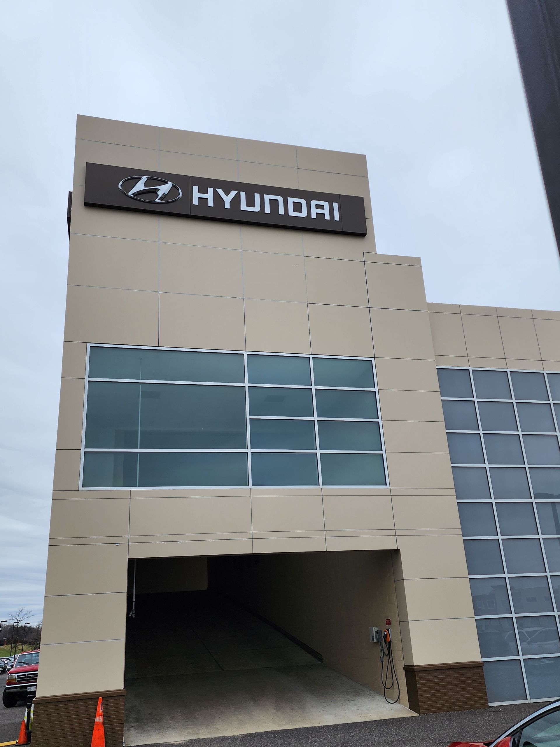 A large building with a sign that says hyundai on it