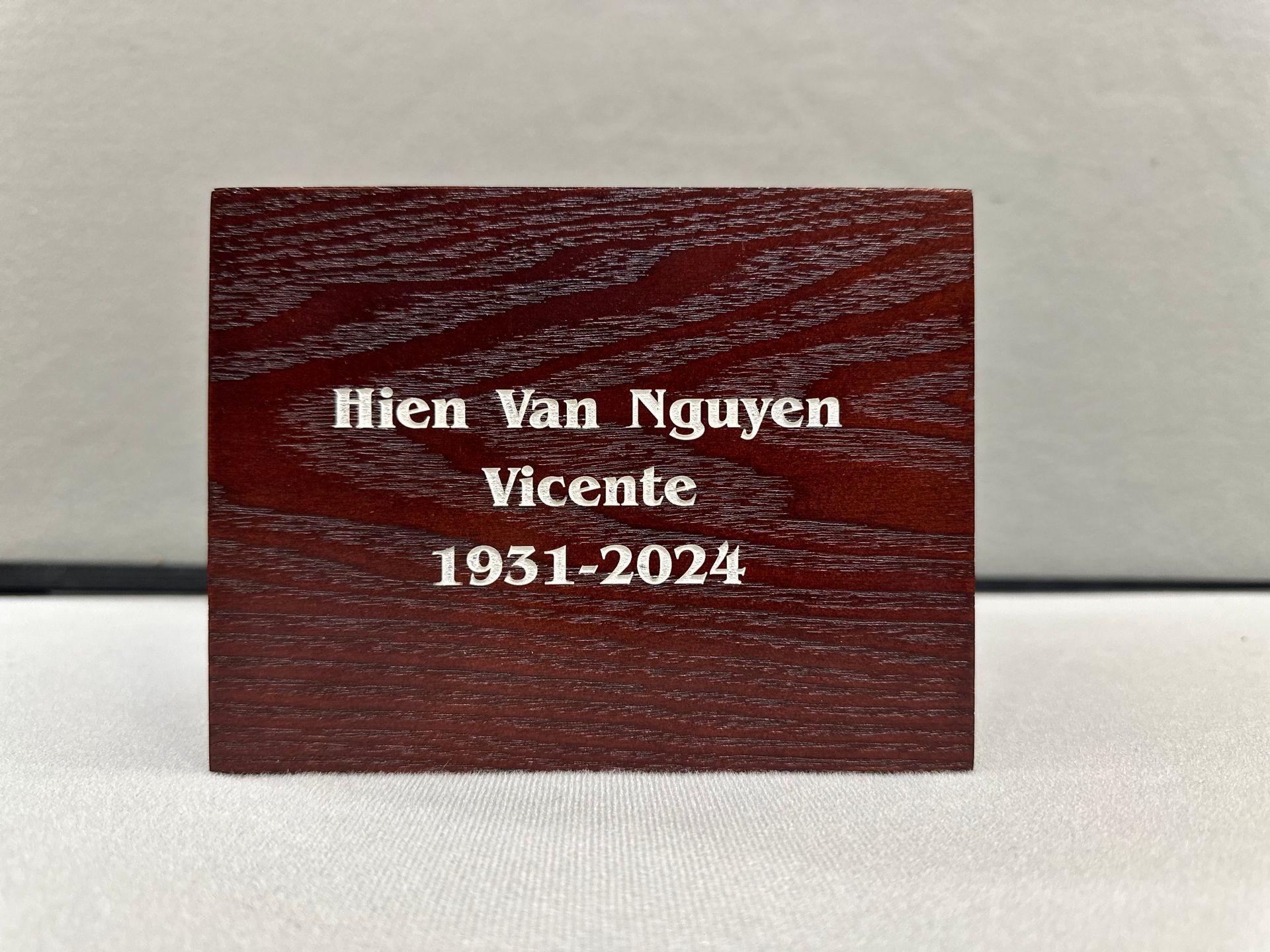 A small piece of wood with the name hien van nguyen on it