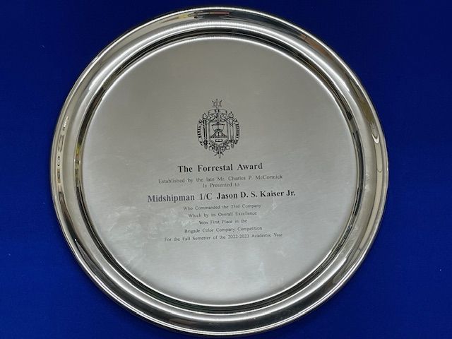 A silver plate that says the eternal award on it