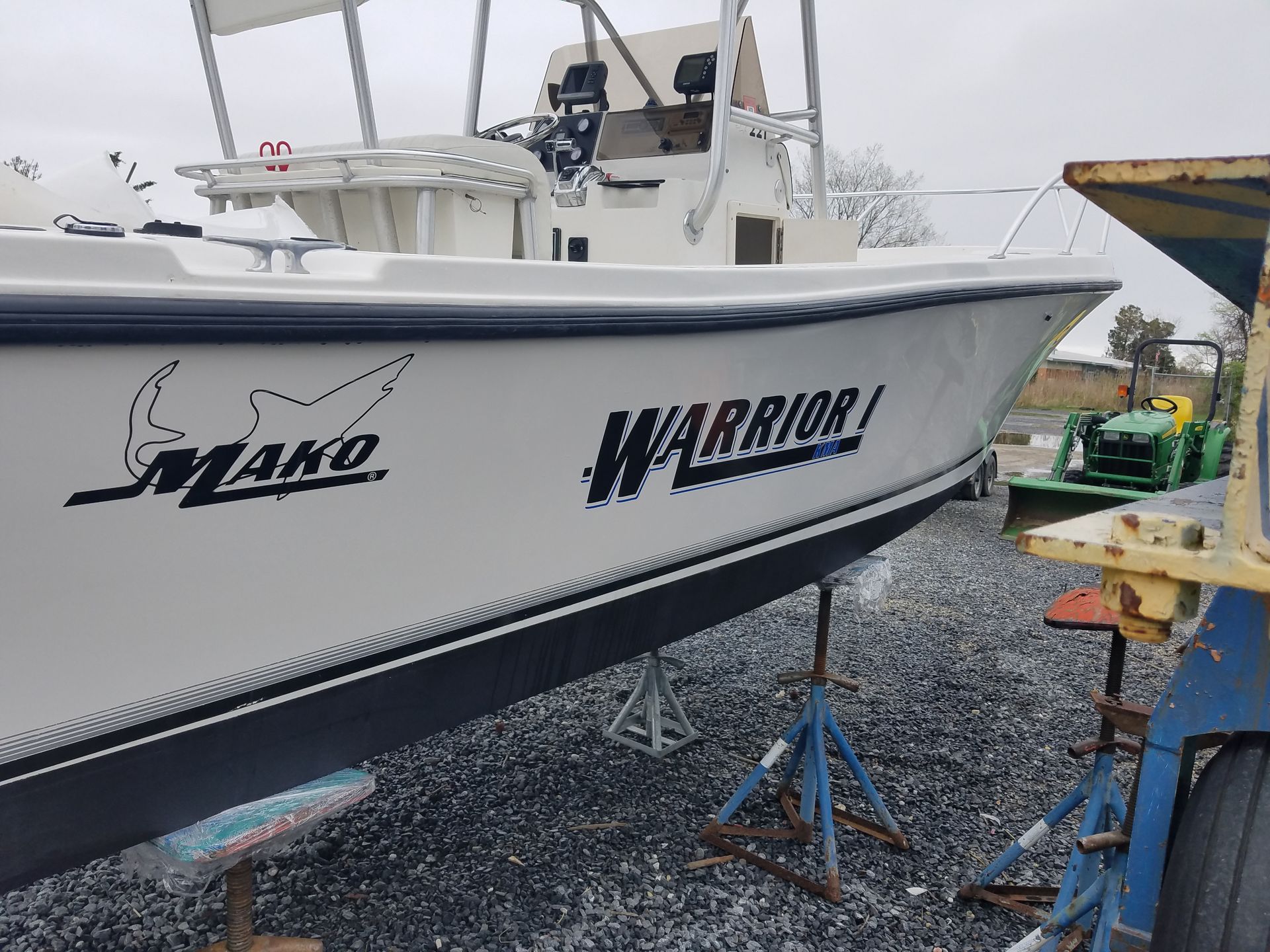A white boat with warrior written on the side