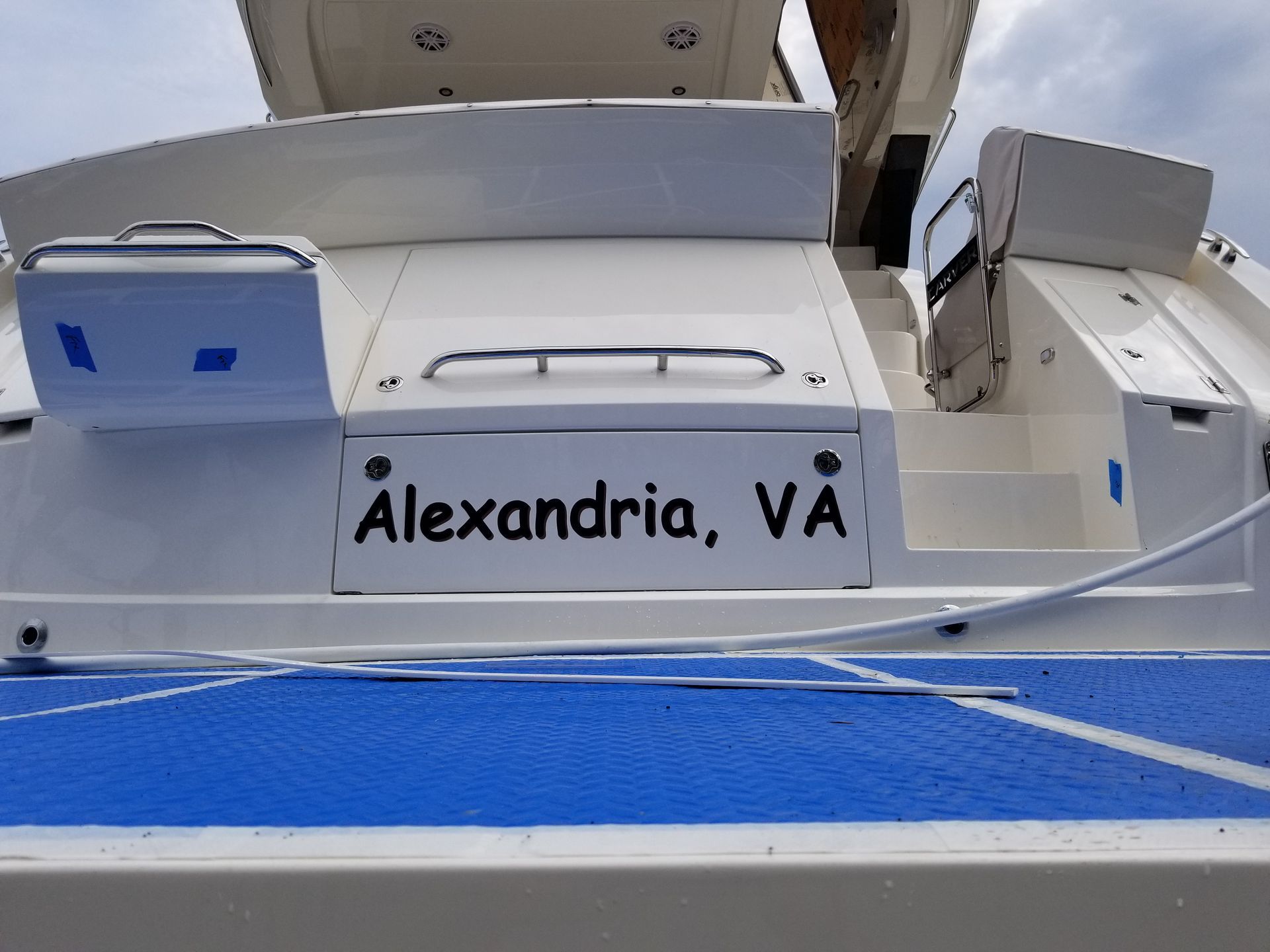 The name alexandria is on the back of a boat