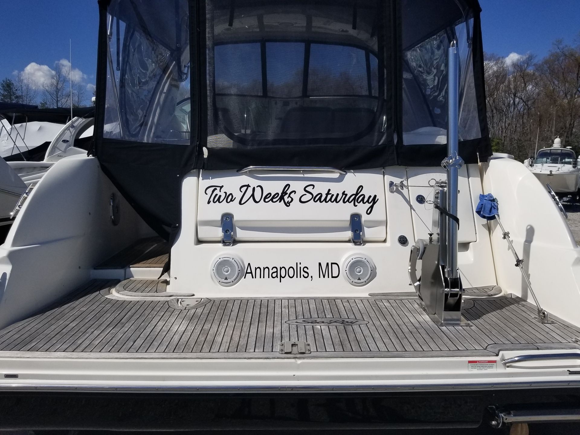 A boat that says two weeks saturday on the back