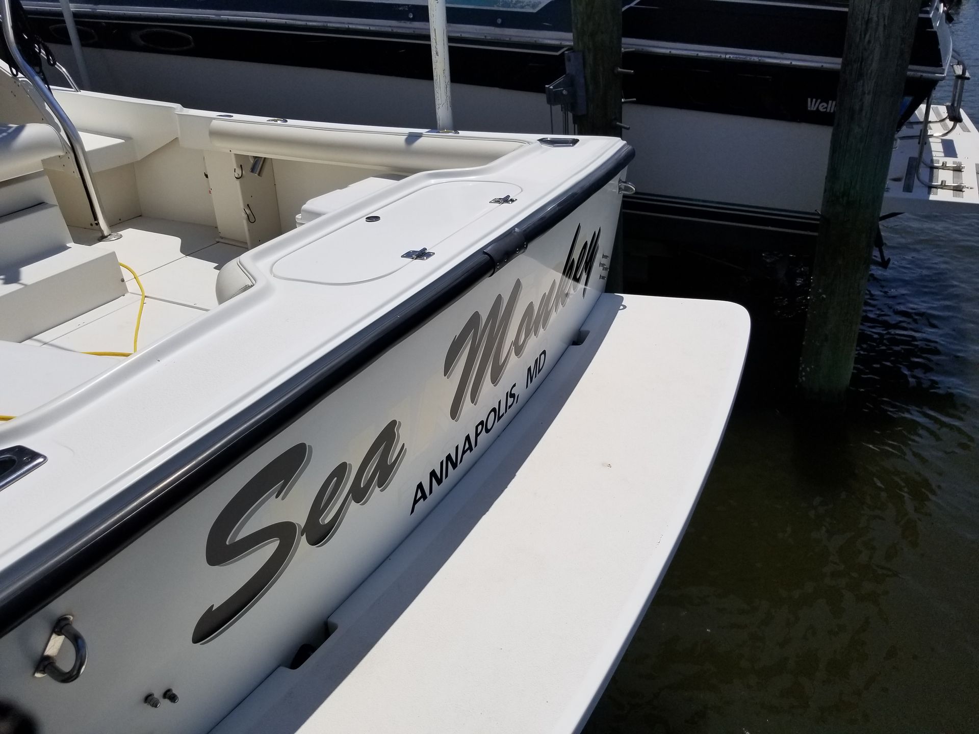 A white boat with the word sea on it