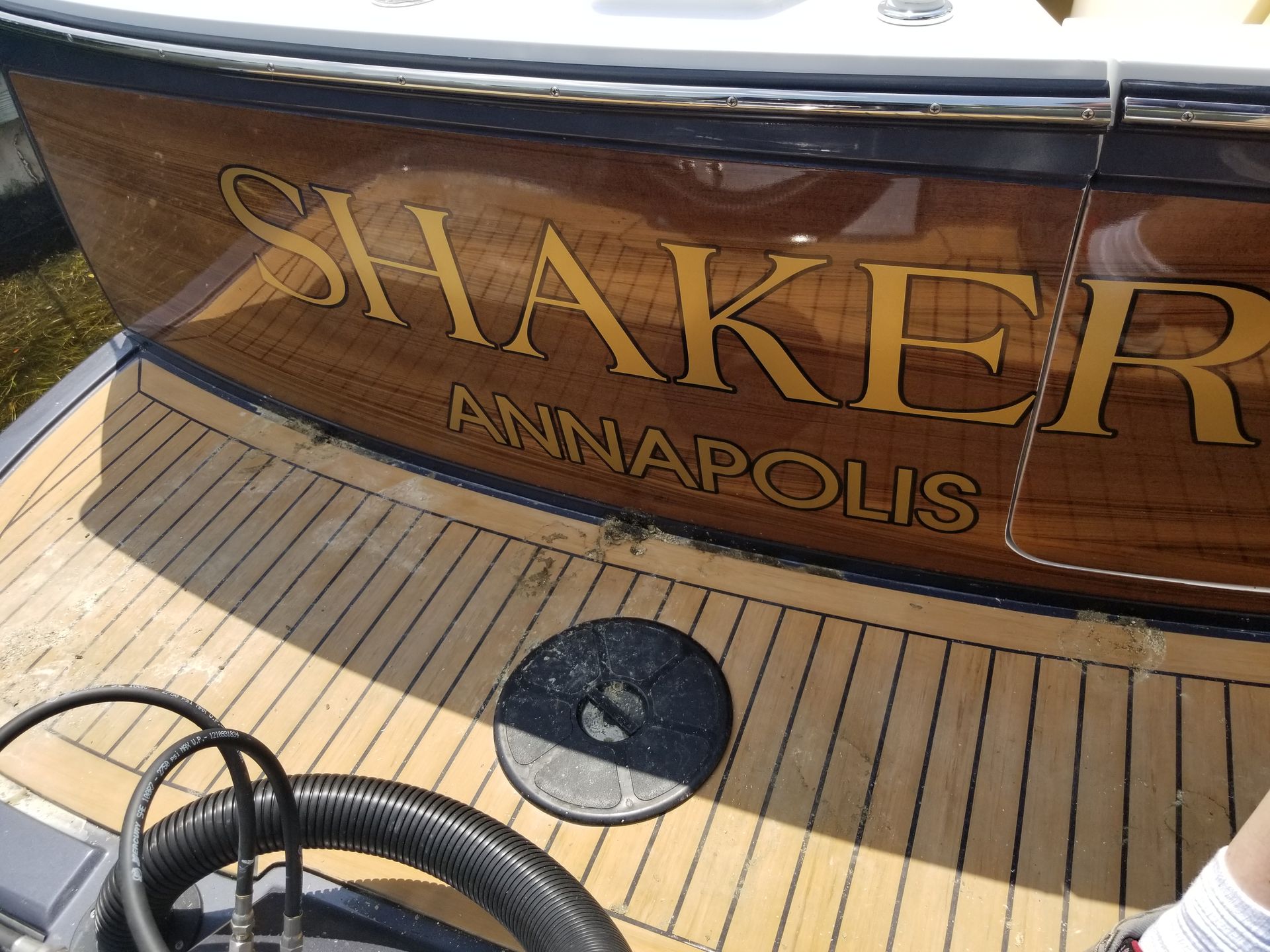 The name shaker is on the side of a boat