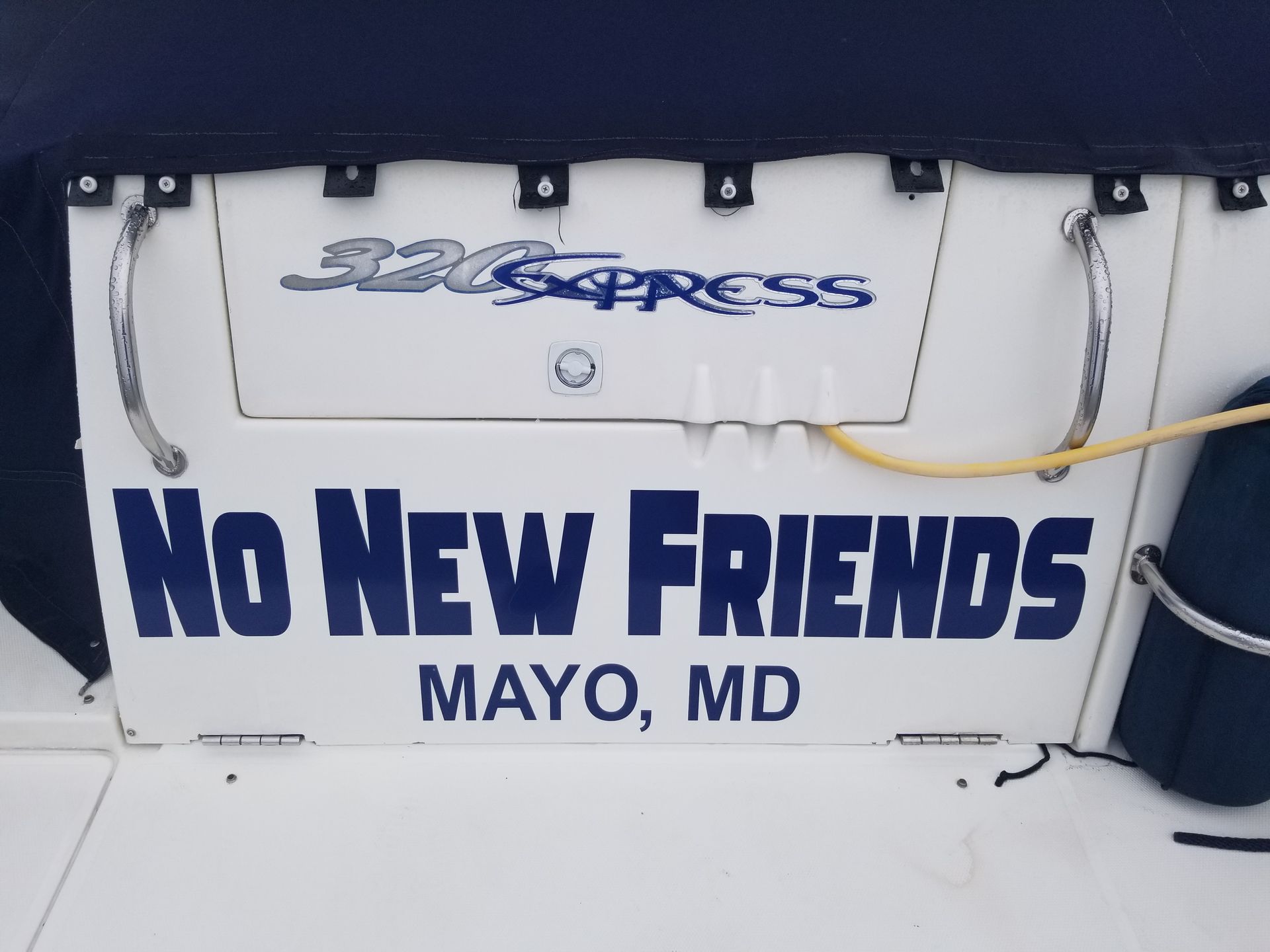 A sign on the back of a boat says no new friends Mayo, MD