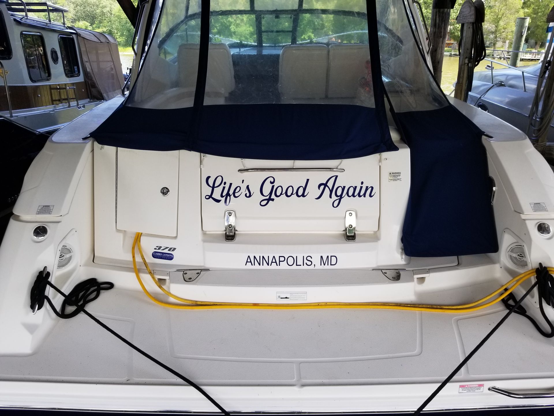 The back of a boat that says life 's good again