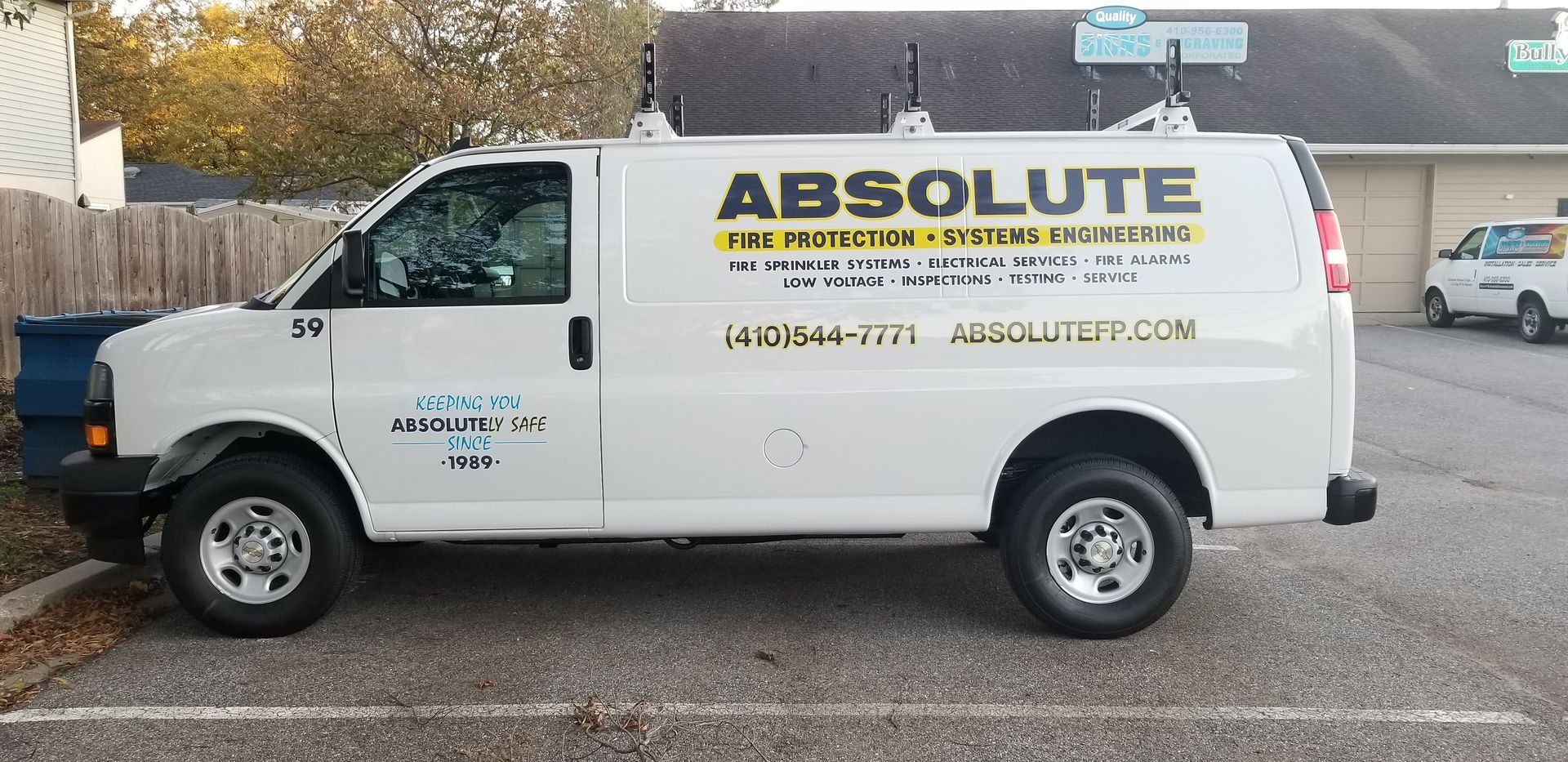 An absolute van is parked in a parking lot